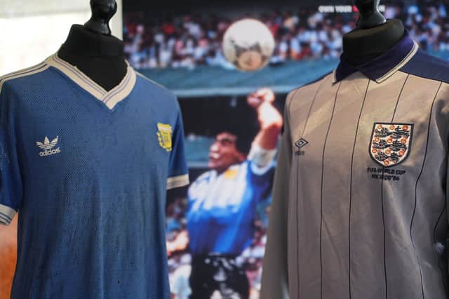 Peter Shilton´s goalkeepers shirt (right), worn during Diego Maradona´s `Hand of God´ goal in the 1986 World Cup match is shown alongside a shirt worn by Diego Maradona during the 1990 World Cup on display at the Royal Garden Hotel, Kensington in London.