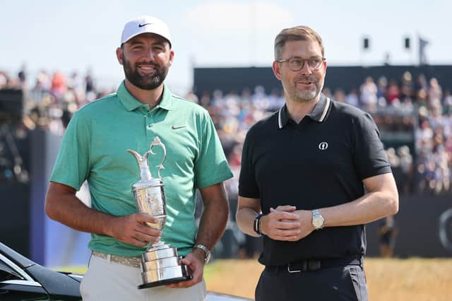 Defending champion Scottie Scheffler pictured with Mark Darbon, CEO of The R&A, after returning the Claret Jug at Royal Birkdale