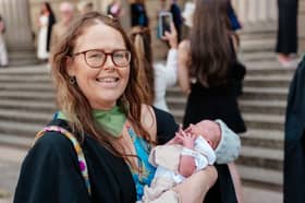 Clare Hart with her newborn baby, Sol, at her graduation ceremony. 