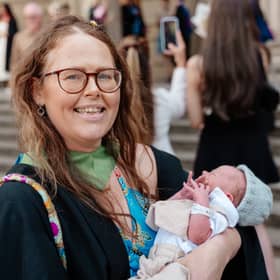Clare Hart with her newborn baby, Sol, at her graduation ceremony. 
