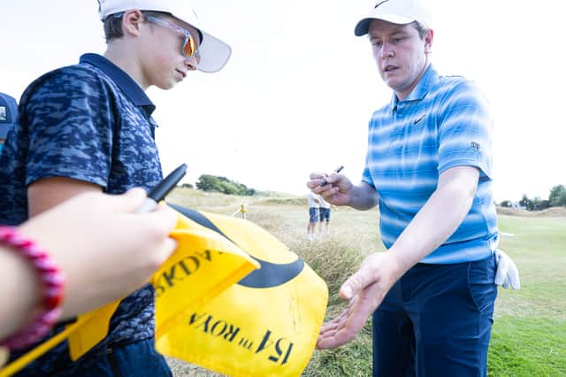 Bob MacIntyre signs autographs at Royal Birkdale, where the Scot is making his seven successive appearance in The Open