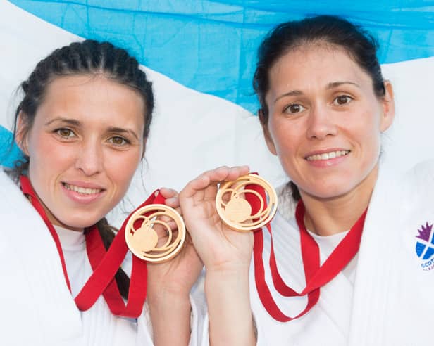 Sisters Kimberley, left, and Louise Renicks with gold medals after their respective judo victories at the Glasgow 2014 Commonwealth Games.