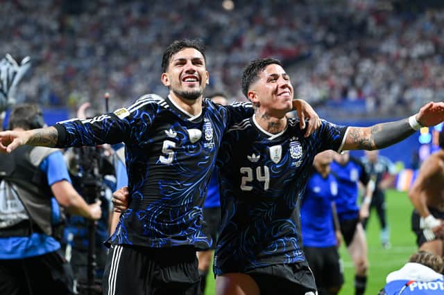 Leandro Paredes #5 and Enzo Fernandez #24 of Argentina celebrate after the 2-1 win over England in the World Cup semi-final at Atlanta Stadium.