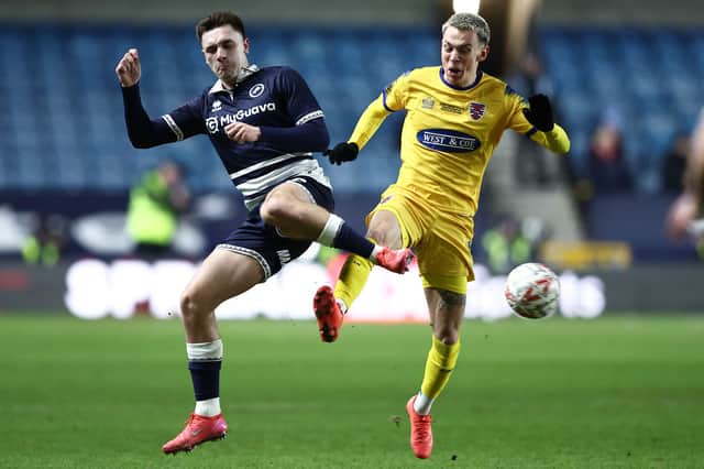 Hibs have completed the signing of Millwall wing-back Adam Mayor.