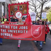 Protesters holding banners reading 'Fighting for jobs at the University of Dundee'
