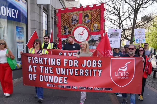 Protesters holding banners reading 'Fighting for jobs at the University of Dundee'