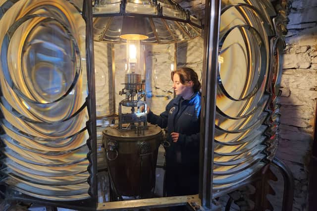 Jeri Cormack inside Noss Head lighthouse's original light at Wick Heritage Centre 