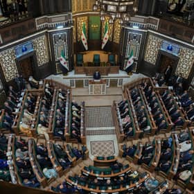 Syria's President Ahmed al-Sharaa (top, centre) addresses the first session of Syria's People's Assembly earlier this month (Picture: Omar Albam)