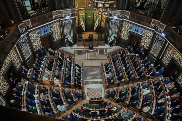 Syria's President Ahmed al-Sharaa (top, centre) addresses the first session of Syria's People's Assembly earlier this month (Picture: Omar Albam)