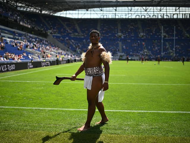 A warrior in traditional Fijian dress on the pitch ahead of the Nations Championship match between Fiji and England at Hill Dickinson Stadium in Liverpool on July 11, 2026.