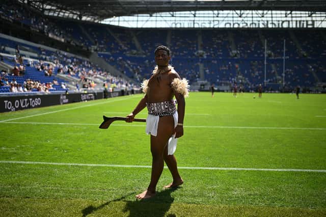 A warrior in traditional Fijian dress on the pitch ahead of the Nations Championship match between Fiji and England at Hill Dickinson Stadium in Liverpool on July 11, 2026.