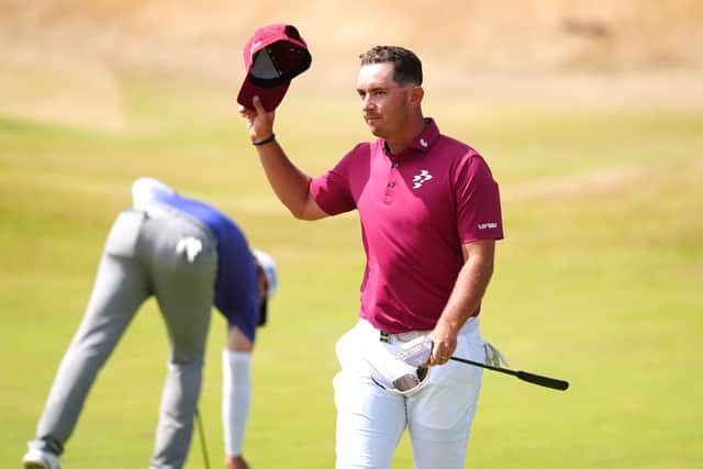 Lucas Herbert acknowledges the crowd on the 18th green after his 62
