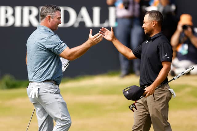 Ryan Fox is congratuled by Xander Schauffele, the only player to have achieved the feat twice, after shooting his 62 in a major on day three of the The 154th Open at Royal Birkdale