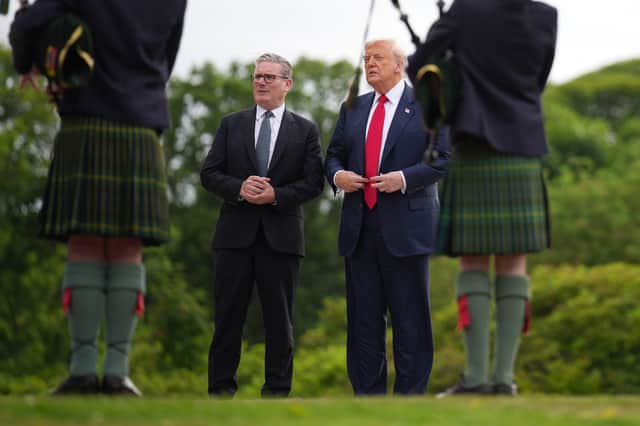 US President Donald Trump with outgoing Prime Minister Sir Keir Starmer at Trump International Golf Links in Balmedie, Aberdeenshire, in July last year