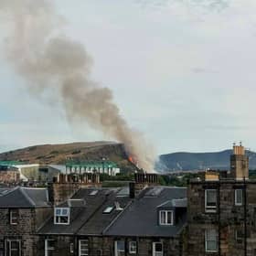 Smoke can be seen for many miles around the city.