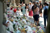 Flowers and other tributes left on the steps of Nottingham Council House after students Barnaby Webber and Grace O Malley-Kumar, both 19, and school caretaker Ian Coates, 65, were killed by a mentally disturbed man in 2023 (Picture: Christopher Furlong)