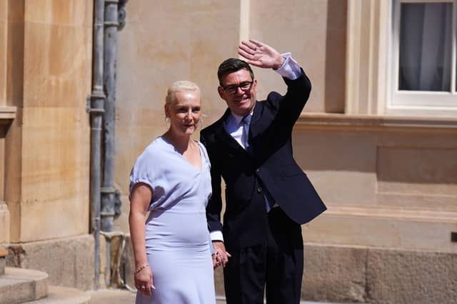 Prime Minister Andy Burnham and his wife Marie-France van Heel, leave Buckingham Palace in London after an audience with King Charles III,