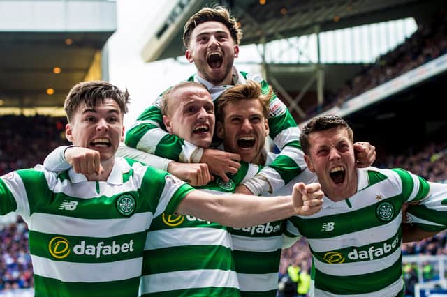 Roberts celebrates a Celtic goal against Rangers in 2017 with his teammates at Ibrox.