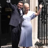 Andy Burnham waves with his wife Marie-France van Heel
