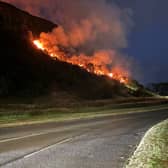 The flames could be seen just metres from Queen's Drive, which was later closed as the fire escalated 