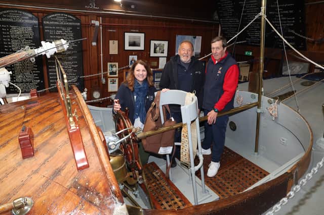 Heritage Fund trustee Dr Heather Reid with museum volunteer custodian Ray Marshall and custodian Mike Webster aboard RNLI Thomas McCunn at Longhope Lifeboat Museum