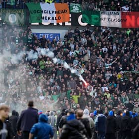 A firework is launched between Celtic and Rangers fans during the March 8 Scottish Cup tie.