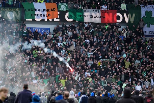 A firework is launched between Celtic and Rangers fans during the March 8 Scottish Cup tie.