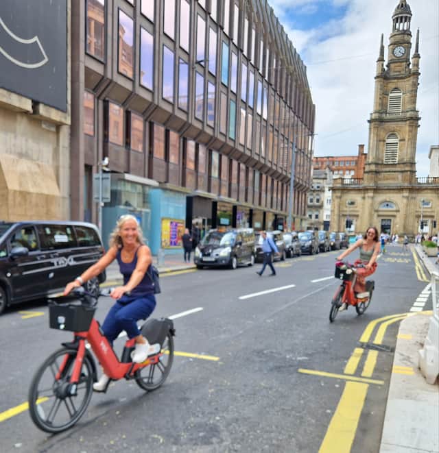Riders on Voi bikes in Glasgow city centre on Wednesday