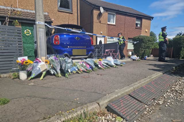 Floral tributes to Vikki Soloman have been left outside a property in Craigievar Square in East Craigs.
