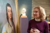 Mary-Louise Wedderburn with her painting by 18th Century Scottish artist, Katherine Read, who is a distant relative. PIC:  Philip Broadhurst/BBC /PA Wire
