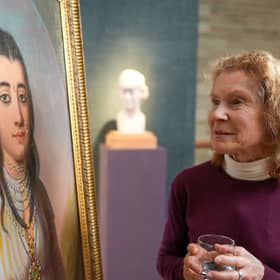 Mary-Louise Wedderburn with her painting by 18th Century Scottish artist, Katherine Read, who is a distant relative. PIC:  Philip Broadhurst/BBC /PA Wire
