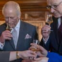 King Charles and First Minister John Swinney  enjoy a dram during a reception at the Palace of Holyroodhouse, Edinburgh, earlier this year