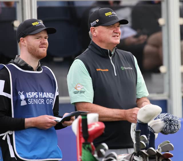 Paul Lawrie chats with his son/caddie Michael on the 1st tee in the second round at Gleneagles