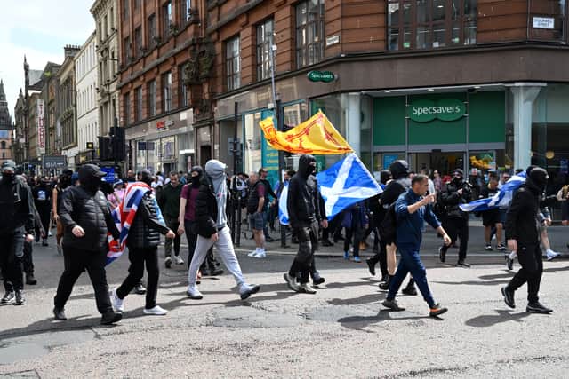 A group of demonstrators from the anti-immigration protest, organised by Unite the Clans Scotland, break away from the rally and march towards Glasgow city centre.