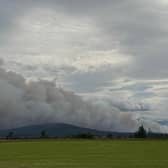 Smoke rises from the wildfire near Nethy Bridge on Friday hours before First Minister John Swinney made a formal request to the Ministry of Defence fo for aerial support to help tackle the blaze, which started on Wednesday, July 15.