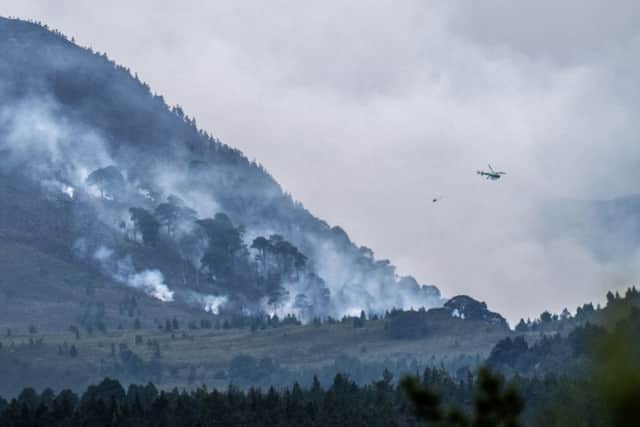 Helicopters have been tackling the devastating wildfire.
