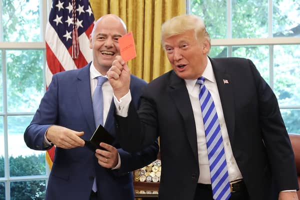 Fifa president Gianni Infantino laughs as Donald Trump pretends to give journalists a red card in the White House (Picture: Chip Somodevilla)