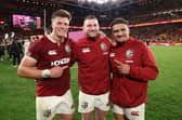 Huw Jones, Finn Russell and Sione Tuipulotu of the British & Irish Lions celebrate after their victory during the first test match of the series between Australia Wallabies and British & Irish Lions at Suncorp Stadium on July 19, 2025 (Pic: SNS)