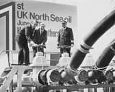 In June 1975, the then Energy Secretary Tony Benn, centre, opened a discharge valve to release the first consignment of oil from the North Sea into a BP refinery in Kent (Picture: Keystone/Hulton Archive)