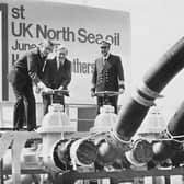 In June 1975, the then Energy Secretary Tony Benn, centre, opened a discharge valve to release the first consignment of oil from the North Sea into a BP refinery in Kent (Picture: Keystone/Hulton Archive)