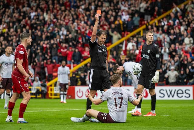 Hearts' Stuart Findlay was sent off during the club's 2-1 defeat by Aberdeen.