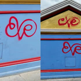 Vandals have targeted Edinburgh's North Bridge with red spray paint less than 24 hours after it reopened after eight years of work