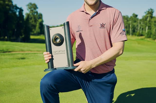 Rory Franssen shows off the trophy after landing his maiden HotelPlanner Tour win to catapult himself into the battle for 15 DP World Tour cards next season