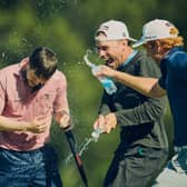 Rory Franssen of Scotland is sprayed with water by some of his compatriots after winning the Infortar Estonian Challenge at Estonian Golf & Country Club in Tallinn on Sunday