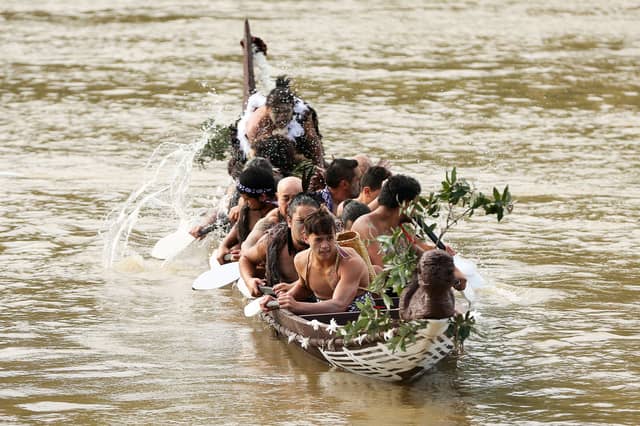 Maori paddle a canoe on the Whanganui River, which has been given legal rights and can now sue its polluters (Picture: Hagen Hopkins)