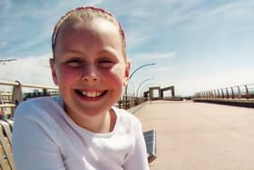 Handout photo of Minnie Merriman smiling, while sitting on a bench outside