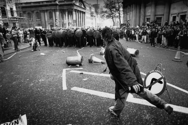 Police and protesters clash in central London during riots that followed the Conservatives’ introduction of the community charge, aka the ‘poll tax’ (Picture: Peter Macdiarmid)