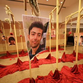 Portraits of Iranian protesters believed to have been executed by the Iranian regime are displayed during a demonstration in Rome last month over the silence of Western governments (Picture: Andreas Solaro)