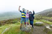 Paul Choat with his daughter Skye and Nicola Roseman CEO of My Name5 Doddie Foundation on Schiehallion