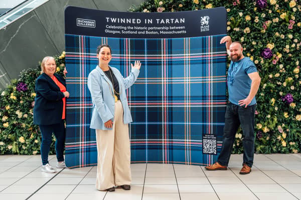 (L-E) Kathy Murdoch, Buchanan Galleries Centre director, Ballie Christy Mearns, deputy lord provost of Glasgow and Steven Caldwell, Slanj Kilts, at unveiling of a bespoke tartan in Glasgow, to celebrate the friendship between Boston and Glasgow, following the Tartan Army takeover of the World Cup host city during this year's tournament.